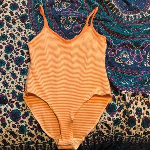 Orange striped body suit